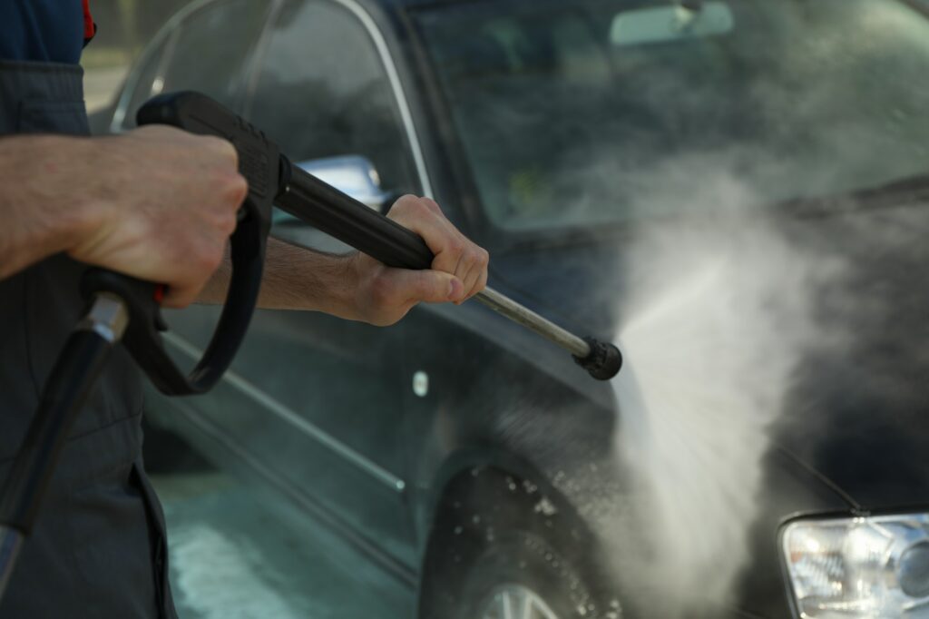 A man washes a car. Clear car concept